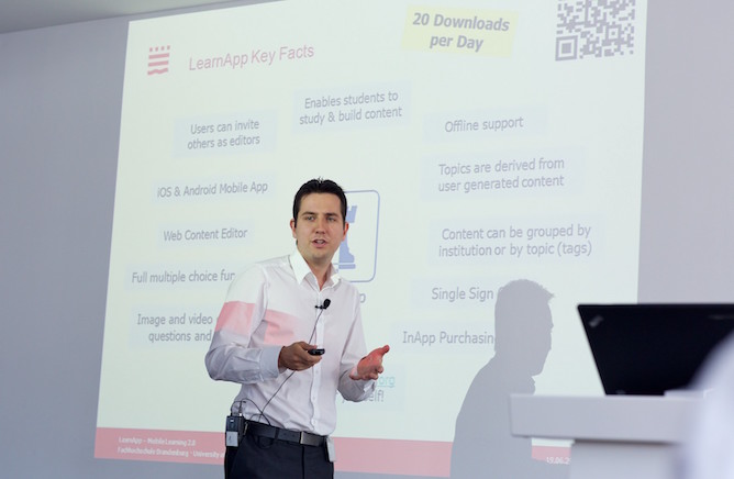 Erik speaking in front of business audience